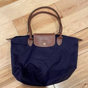 15” wide X 11”. Navy blue medium sized LONGCHAMP bag. Good condition!